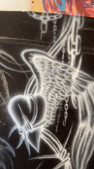 Street artist creates heart-and-wings design in Buenos Aires