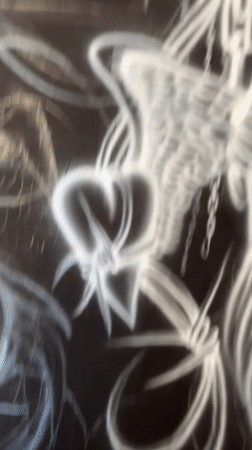 Street artist creates heart-and-wings design in Buenos Aires