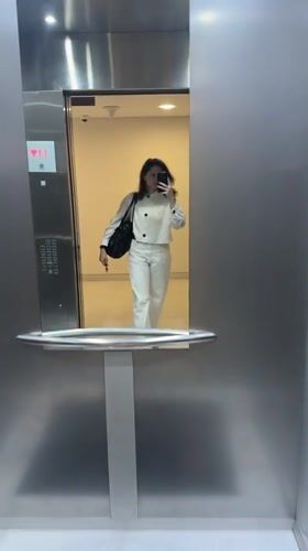 Woman takes elevator selfie in Dubai early morning