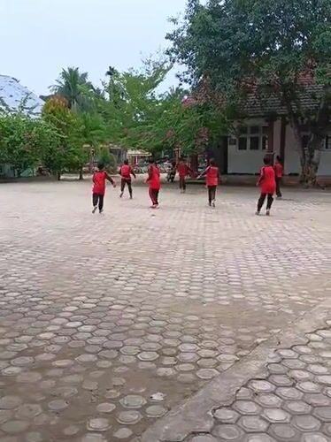 School day in Baratpayaitek: soccer, classrooms, and garden plants