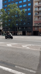 Witness documents ordinary Barcelona street life during sunny morning