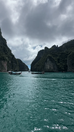 Boat traffic among Ao Nang's limestone cliffs and turquoise water
