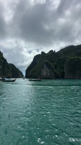 Boat traffic among Ao Nang's limestone cliffs and turquoise water