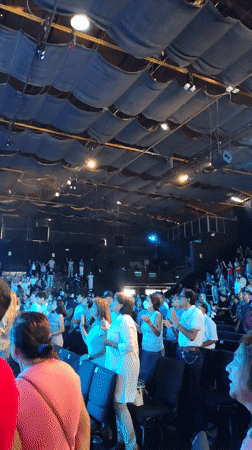 Christian worship band performs at packed auditorium in Peru