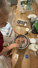 Mother and daughter cook together in Russian kitchen
