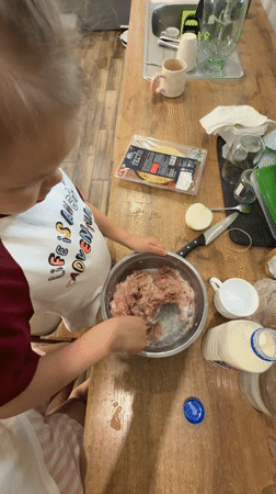 Mother and daughter cook together in Russian kitchen