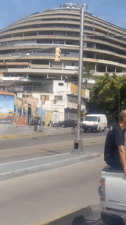 Street-level views near a circular landmark in Caracas