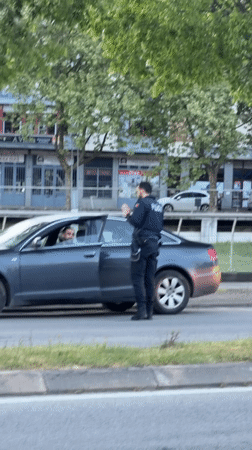 Police officer conducts traffic stop in Bragança, Portugal