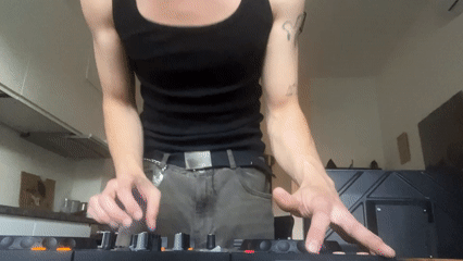 DJ operates controller in Milan street performance