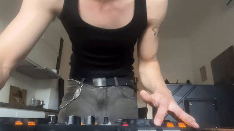 DJ operates controller in Milan street performance