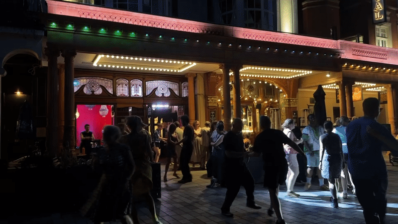 Late-evening dancing outside The Ivy in Brighton