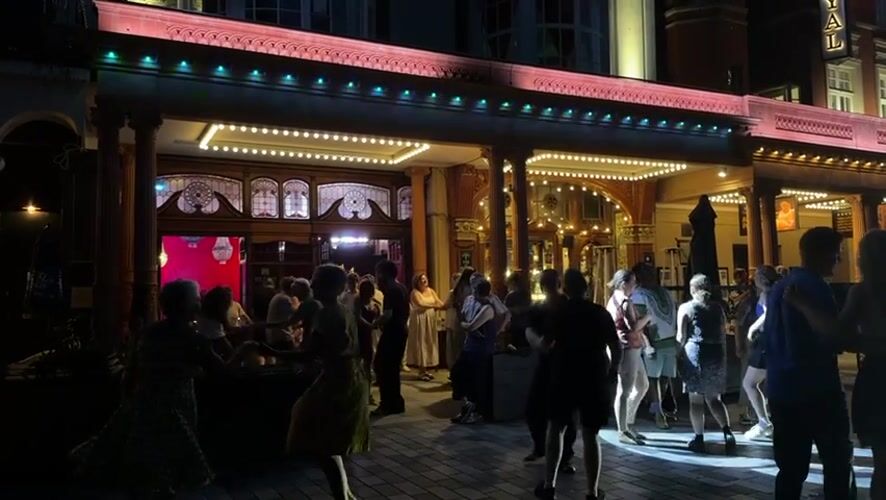 Late-evening dancing outside The Ivy in Brighton