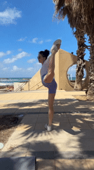 Woman performs outdoor fitness routine in Netanya