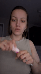 Woman takes selfies indoors in Reshetnikovo, Russia