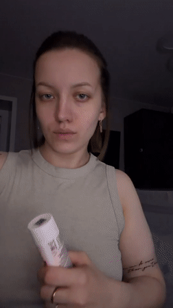 Woman takes selfies indoors in Reshetnikovo, Russia