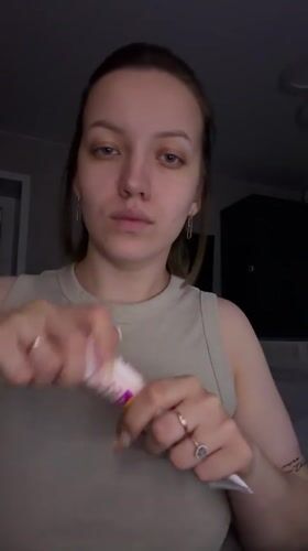 Woman takes selfies indoors in Reshetnikovo, Russia