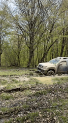 Off-road vehicles stuck in muddy terrain near Manavi, Georgia