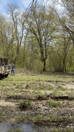 Off-road vehicles stuck in muddy terrain near Manavi, Georgia