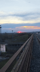 Sunset documented from multiple angles near Chaikovsky railway tracks