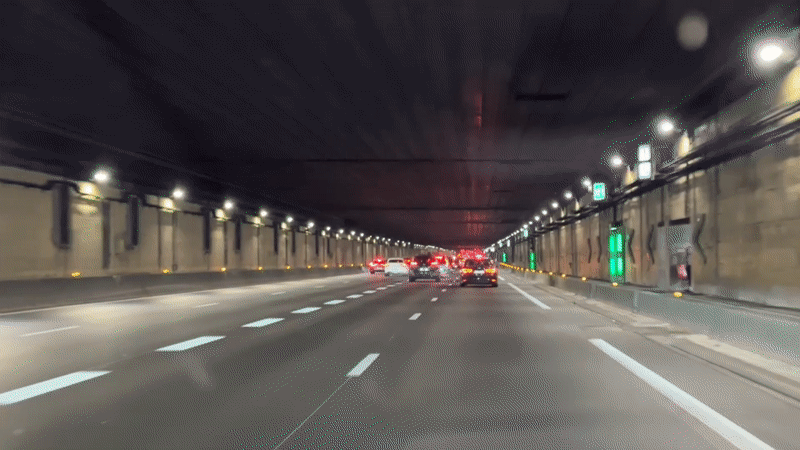 Night drive through a lit tunnel in Saint-Denis