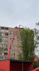 Construction work underway on building roof in Mytishchi