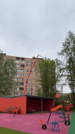 Construction work underway on building roof in Mytishchi