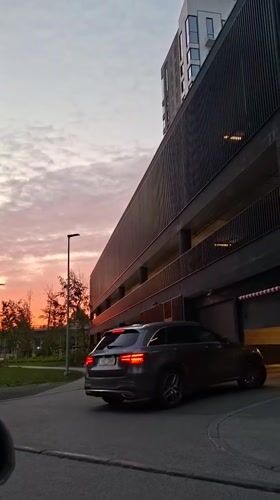 Evening rush hour captured at Tallinn parking garage during sunset