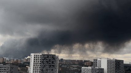 Dark smoke column rises over Lyubertsy residential skyline