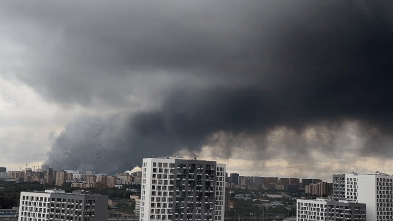 Dark smoke column rises over Lyubertsy residential skyline