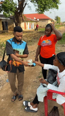 Cash and card transaction on a Narayi dirt road