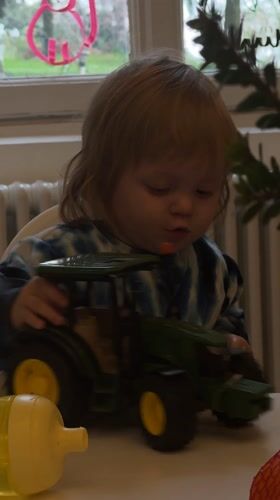Domestic scenes documented in Erba: child playing, kitchen prep, flowers