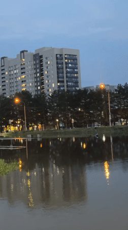 Severe street flooding swamps Barnaul residential district at dusk