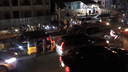 Nighttime traffic congestion observed on busy city street