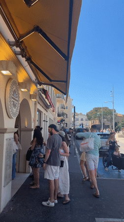 Busy street scene captured in Saint-Tropez on sunny day