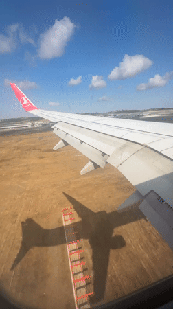 Airplane window view over dry Turkish landscape near Istanbul