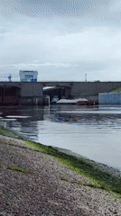 Morning barge traffic and fishing activity at Chaikovsky Lock