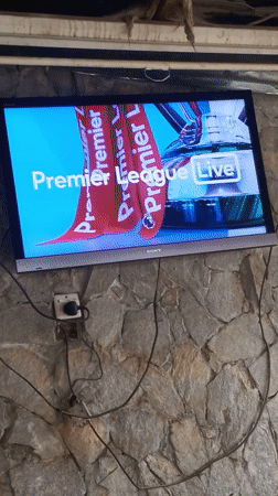 Jos resident watches Arsenal-Manchester City Premier League match on TV