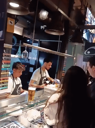 Food market activity documented in Madrid marketplace