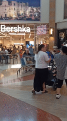 Inside Molfetta's Mongolfiera mall on a Sunday morning