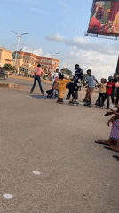 Children Learn Roller Skating on Jos Streets with Adult Instruction