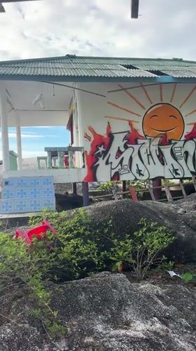 Graffitied abandoned buildings documented along Thailand coastal village