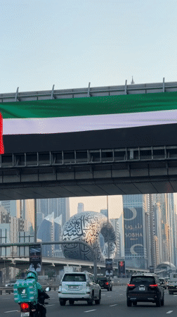 Vehicle drives Dubai highway past iconic landmarks