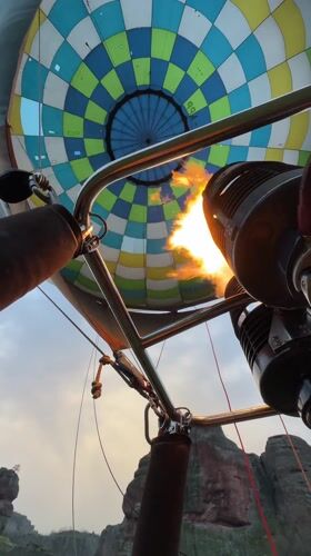 Tourist documents early morning visit to Bulgarian fortress, balloon flight