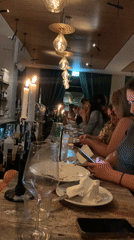 Evening diners finish meals at Tel Aviv restaurant bar