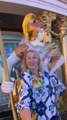 Pattaya festival venue at night, fountains, gold statues, floral displays