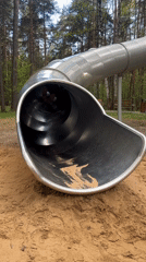 Adult woman enjoys playground equipment in Perm park