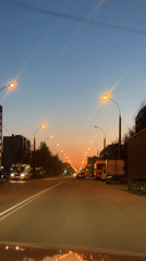 Evening drive through decorated urban streets captured from Audi