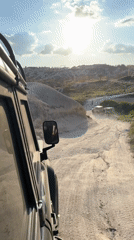 Off-road vehicle convoy travels dusty terrain near Ürgüp, Turkey