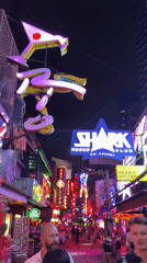 Bangkok nightlife district bustling with neon-lit bars and businesses