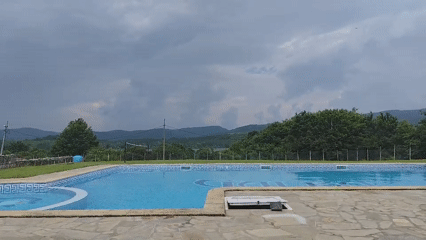 Cloudy day at outdoor pool in Brachkovtsi, Bulgaria